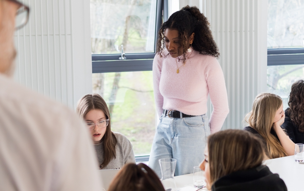 Img: Women engineer from Crux working with an Ashton Park student on a STEM programme.